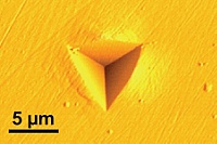 AFM recording of the indentation of a Berkovich tip in steel