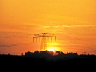 Foto: Sunset and power pylons ©Copyright: HZDR/Peter Joehnk