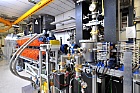 Foto: The two THz sources at the ELBE accelerator: the diffraction radiator source (right) and the undulator source (orange part). ©Copyright: HZDR/F. Bierstedt